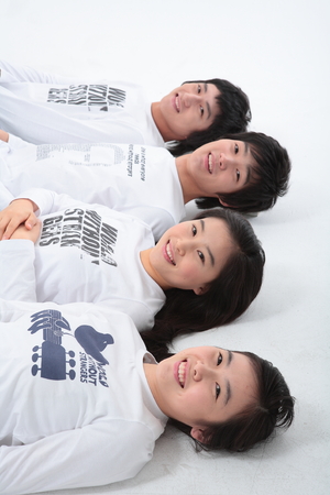 Young college students in studio - isolated on whiteの写真素材
