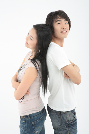 Young college students in studio - isolated on whiteの写真素材