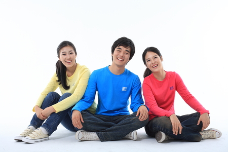 Young college students in studio - isolated on whiteのeditorial素材