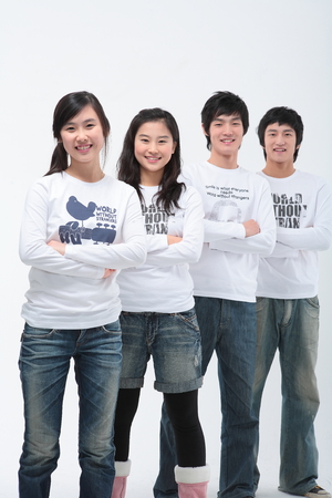 Young college students in studio - isolated on whiteの写真素材