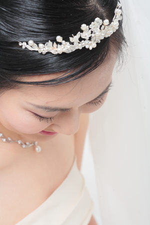 High angle portrait of beautiful Asian bride's faceの写真素材