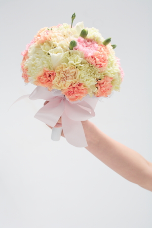 Close up shot of bouquet held by brideの写真素材
