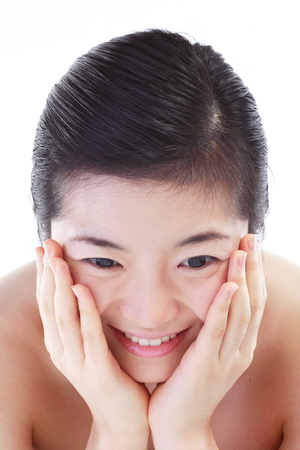 Beauty Concept - Close up shot of Asian woman's face, isolated on whiteの写真素材