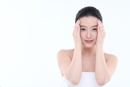 Beauty Concept - Young Asian woman with fresh skin, isolated on whiteの写真素材