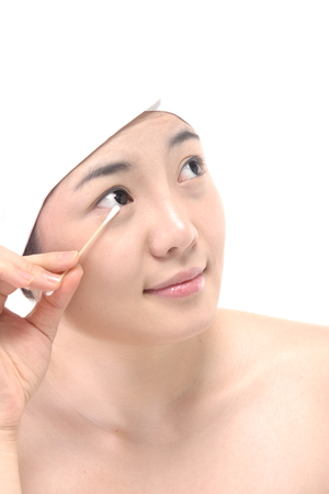 Beauty Concept - Beautiful Asian woman with a Q-tipの写真素材