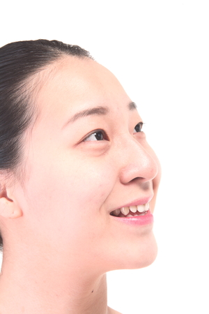 Beauty Concept - Close up shot of Asian woman's fresh skin, isolated on whiteの写真素材