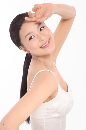 Beauty Concept - Beautiful Asian woman with perfect skin, isolated on whiteの写真素材