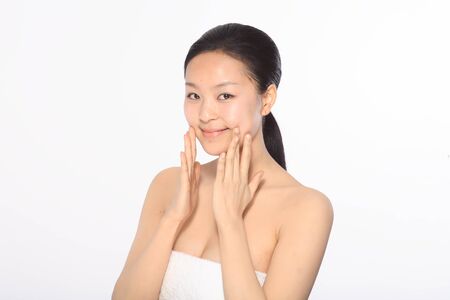 Beauty Concept - Beautiful Asian woman with perfect skin, isolated on whiteの写真素材