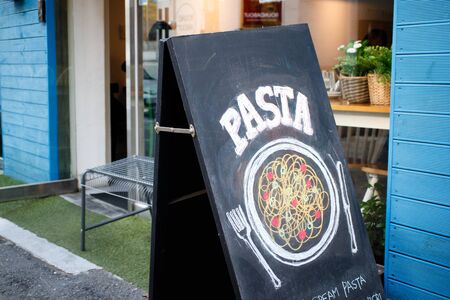 Café window with yellow wallの写真素材