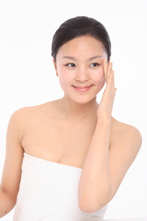 Beauty Concept - Beautiful Asian woman with perfect skin, isolated on whiteの写真素材