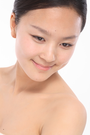 Beauty Concept - Beautiful Asian woman with perfect skin, isolated on whiteの写真素材