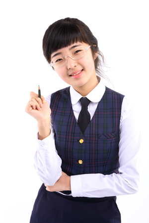 A high school girl in the studio,isolated on white.の写真素材