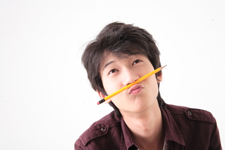 A young guy in the studio,isolated on white.の写真素材