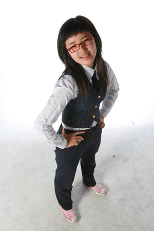 A High school girl in the studio,isolated on white.の写真素材