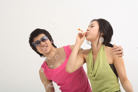 Summer holiday concept - Young Asian couple on vacation,isolated on whiteの写真素材