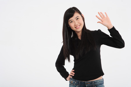 A teenage girl in the studio,isolated on white.の写真素材