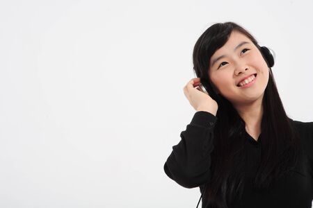 A teenage girl in the studio,isolated on white.の写真素材