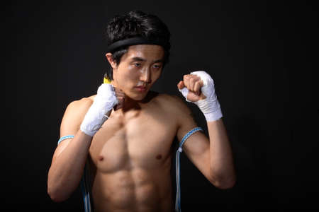 Asian fighter, boxing, kickboxing, Muay Thai - isolated on blackの写真素材