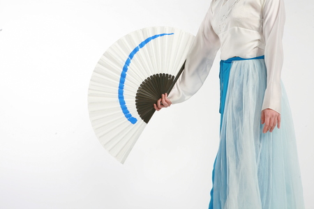Beautiful Korean female dancer in white Korean traditional dress, Hanbok - isolated on whiteの写真素材