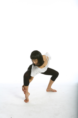 Beautiful asian female modern dancer - isolated on whiteの写真素材