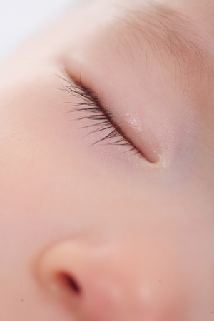 Close-up shot of a face of a sleeping babyの写真素材