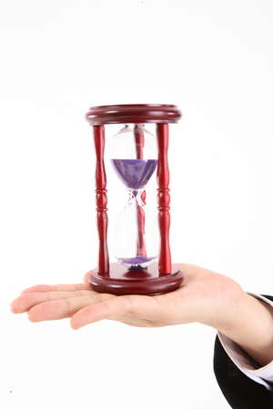 Sandglass on a handの写真素材