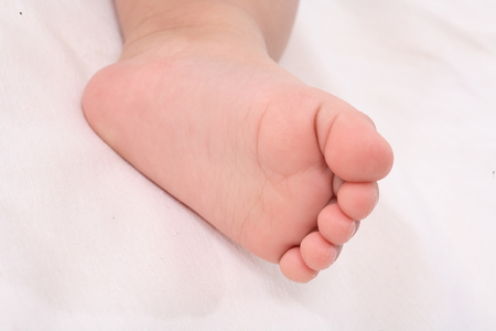 Close-up shot of a baby's footの写真素材