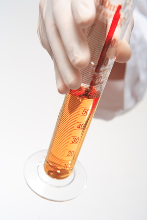 Close-up shot of a hand holding a cylinderの写真素材