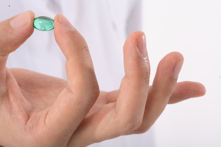 Close-up shot of holding a pill