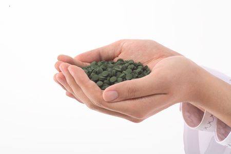 Close-up shot of handful of pillsの写真素材