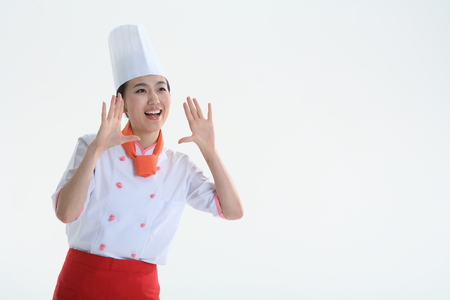A female cook with hand gestureの写真素材
