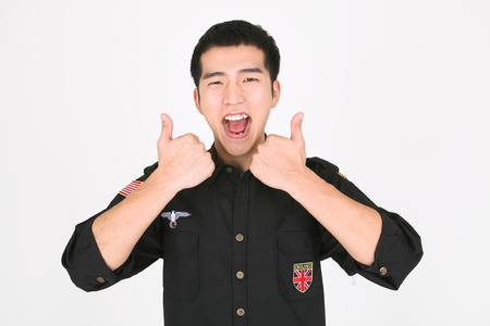 A male bartender with thumbs upの写真素材
