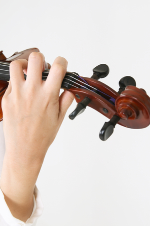 Isolated shot of violinist's handの写真素材