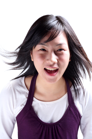 Close up shot of a smiling face of a woman in twentiesの写真素材