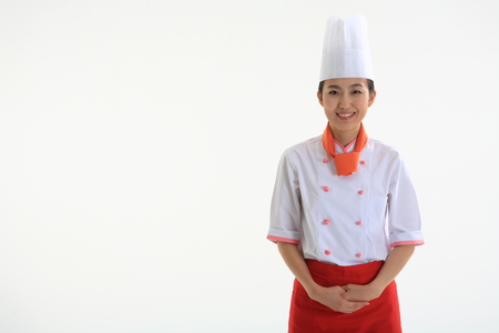 A female cook bowingの写真素材