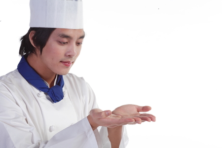 Close up shot of a male cook showing empty palms to the frontの写真素材