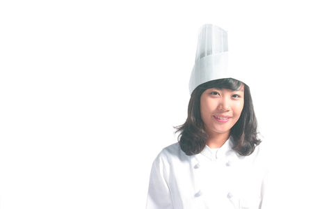 Close up shot of a female cook with toothy smileの写真素材