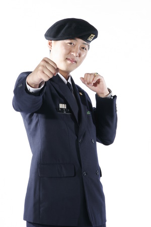 A male soldier showing a fist as in cheering poseのeditorial素材