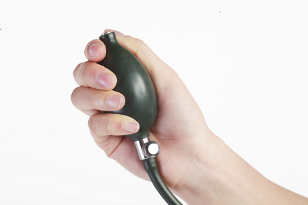 Isolated shot of a sphygmomanometer being used by a female nurse