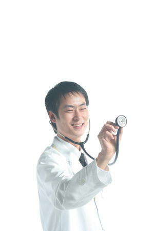 Close up shot of A male doctor applying the stethoscope in the air as demonstrationの写真素材