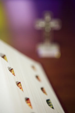 Isolated shot of thumb index of the bible opened on the deskの写真素材