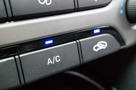 Close up shot of control buttons inside of a compact carの写真素材