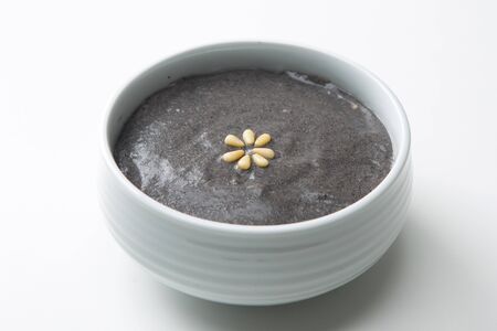 Slow food - Black sesame rice soup/porridge shot in studioの写真素材