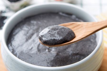Slow food - Black sesame rice soup/porridge shot in studioの写真素材