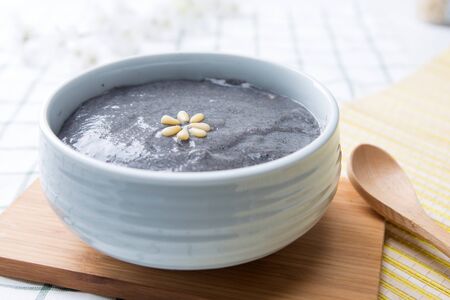 Slow food - Black sesame rice soup/porridge shot in studio
