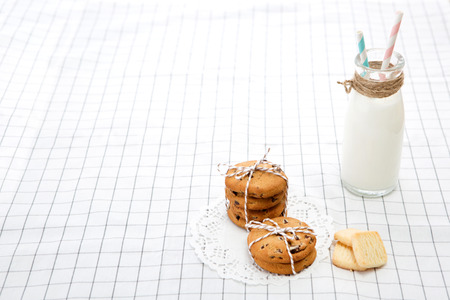Sweet desserts - Various kinds of cookies and a bottle of milk