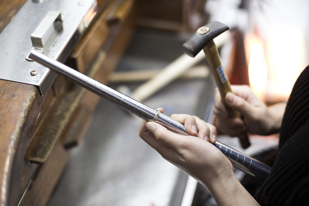 Isolated shot of hands of handmade craft jewerly experts holding tools/machinesの写真素材