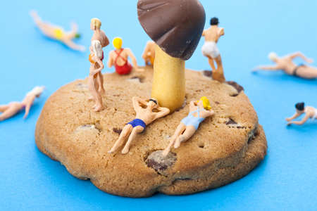 Creative miniature life - People/travelers/tourists in bathing suis on vacation on the beach/islandの写真素材