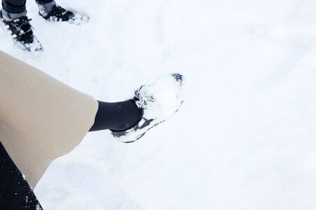 Close up shot of feet covered in snowの写真素材