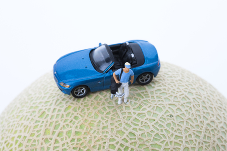 Creative miniature life - Road trip with a blue sports carの写真素材